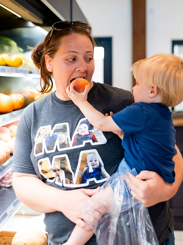 MarketonMainOpening-369 Little Boy and Mom enjoying produce